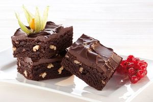Three gluten-free brownies arranged on a plate