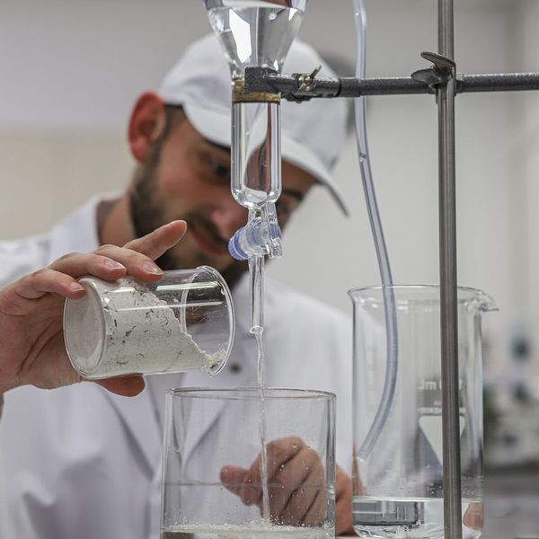 Laboratory employee carrying out acidity level measurement